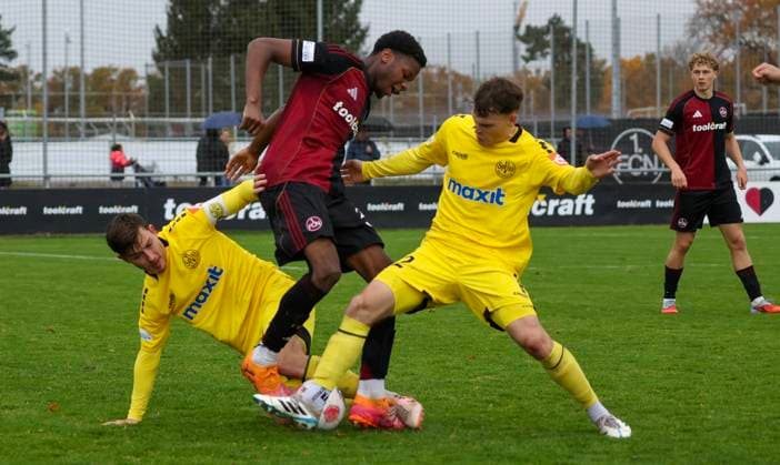 02 11 2025 Soccer Season 2025 2026 Regionalliga Bayern 16 Matchday 1 FC Nürnberg FCN II Club SpVgg Bayreuth MiOt xmixotx 02 11 2025 Soccer Season 2025 2026 Regionalliga Bayern 16 Matchday 1 FC Nürnberg FCN II Club SpVgg Bayreuth MiOt xmixotx Nicolas Andermatt SpVgg Bayreuth, yellow jersey, lying and Leon Bucher SpVgg Bayreuth, yellow jersey, standing against Winners Osawe