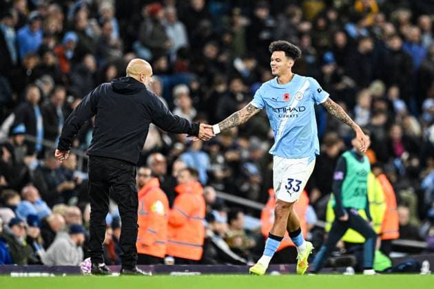 2nd November 2025; Etihad Stadium, Manchester, Lancashire, England; Premier League Football, Manchester City versus AFC Bournemouth; Nico O Reilly of Manchester City gets a high five from Manchester City Manager Pep Guardiola after scoring in the 60th minute to make the score 3-1  GodfreyxPitt