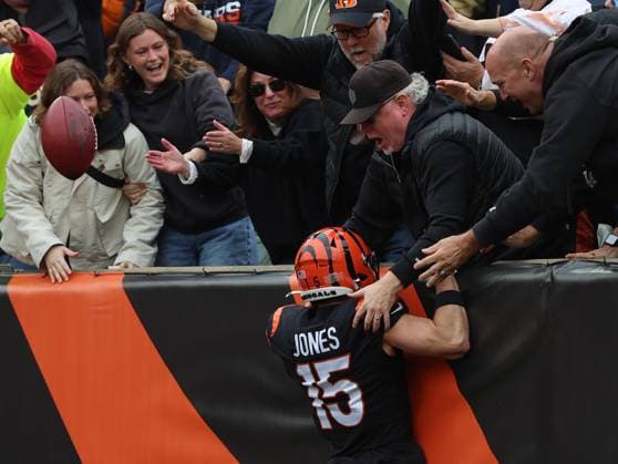 Cincinnati Bengals kick returner Charlie Jones (15) celebrates returning the opening kickoff for a touchdown against the Chicago Bears during the first half of play at Paycor Stadium on Sunday, November 2, 2025 in Cincinnati, Ohio.  KYP20251102006 JOHNxSOMMERSxII