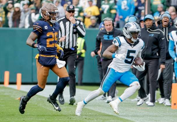 Carolina Panthers running back Rico Dowdle (R) is run out of bounds by Green Bay Packers cornerback Keisean Nixon (L) in the second half of the NFL, American Football Herren, USA game between the Carolina Panthers and the Green Bay Packers at Lambeau Field in Green Bay, Wisconsin on Sunday, November 2, 2025. The Panthers defeated the Packers 16-13.  GBW20251102829 TANNENxMAURY