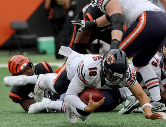 Chicago Bears quarterback Caleb Williams (18) is sacked by Cincinnati Bengals Myles Murphy (99) during the first half of play at Paycor Stadium on Sunday, November 2, 2025, in Cincinnati, Ohio.  KYP20251102044 JOHNxSOMMERSxII