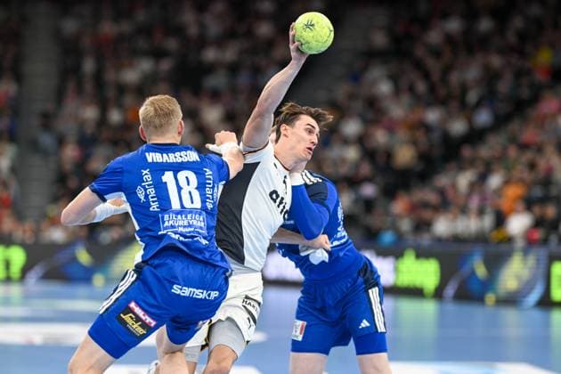 DHB 25 26 Germany Iceland on 02 11 2025 at SAP Garden in Munich Mirco Schluroff Germany in a duel against Ymir Gislason Iceland and Ellidi Vidarsson Gummersbach Iceland MT