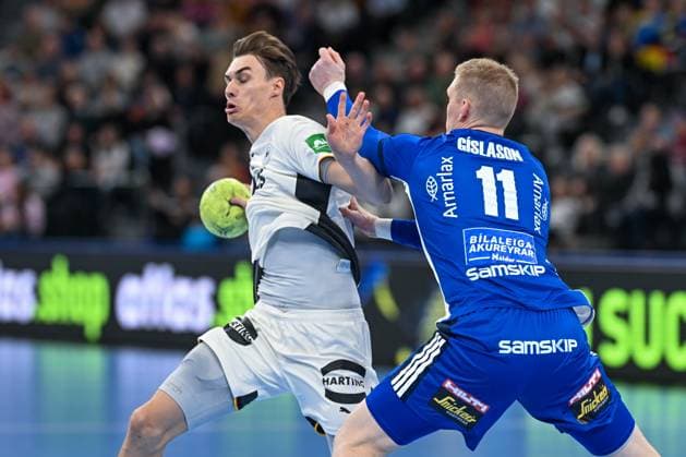 DHB 25 26 Germany Iceland on 02 11 2025 at SAP Garden in Munich Mirco Schluroff Germany in a duel against Ymir Gislason Iceland MT