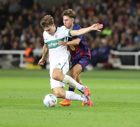 November 2, 2025, Sabadell, Barcelona, Spain: Barcelona Spain 02.11.2025 Fermin Lopez FC Barcelona, Barca and David Affengruber (Elche CF) battle for the ball during the La Liga EA Sports between FC Barcelona and Elche CF at Estadi Olimpic Lluis Companys on 02 November 2025 in Barcelona. Sabadell Spain - ZUMAu50_ 20251102_zsp_u50_017 Copyright: xXavixUrgelesx