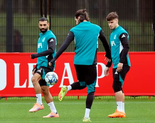 3rd November 2025; Anfield, Liverpool, Merseyside, England; UEFA Champions League Football, Liverpool versus Real Madrid press conference, PK, Pressekonferenz Dominik Szoboszlai, Mohamed Salah and Milos Kerkez warm up before the open training session ahead of tomorrow s Champions League Group match vs Real Madrid  AlanxMartin