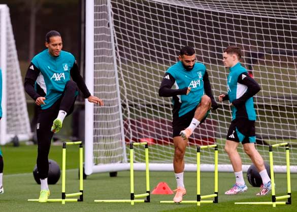 3rd November 2025; Anfield, Liverpool, Merseyside, England; UEFA Champions League Football, Liverpool versus Real Madrid press conference, PK, Pressekonferenz Virgil van Dijk and Mohamed Salah of Liverpool warm up before the open training session ahead of tomorrow s Champions League Group match vs Real Madrid  AlanxMartin
