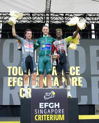2nd November 2025, Marina Bay Circuit, Marina Bay, Singapore; Tour de France EFGH Singapore Criterium 2025 Cycling; (l-r) Jasper Philipsen of Team Alpecin Deceunick, Jonathan Milan of Team Lidl Trek and Biniam Girmay of Team Intermarche Wanty wave to the crowd after receiving their trophies  StevexFlynn