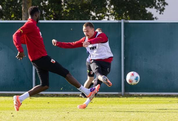 Phillip Tietz FC Augsburg 21 shot on goal in front of Chrislain Matsima FC Augsburg 5 FC Augsburg, training,