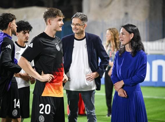 Football, Junior U 17 World Cup 2025 Doha Qatar preliminary round 04 11 2025 Group G Germany Colombia President of the UN General Assembly, Annalena Baerbock right in conversation with Ben Kieffer left after the match, Oliver Owcza center back, German Ambassador to Qatar