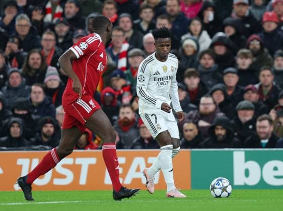 Liverpool, England, 4th November 2025. Vinicius Junior of Real Madrid takes on Ibrahima Konate of Liverpool during the Liverpool vs Real Madrid UEFA Champions League match at Anfield, Liverpool. Picture credit should read: James Baylis Sportimage EDITORIAL USE ONLY. No use with unauthorised audio, video, data, fixture lists, club league logos or live services. Online in-match use limited to 120 images, no video emulation. No use in betting, games or single club league player publications. SPI_022_JB_LIVERPOOL_REAL_MADRID SPI-4264-0022