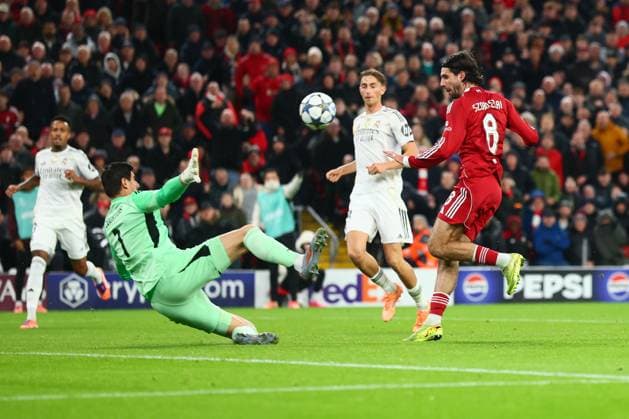 Thibaut Courtois of Real Madrid saves from Dominik Szoboszlai of Liverpool Liverpool v Real Madrid, UEFA Champions League, Group Stage, Football, Anfield, Liverpool, UK - 04 Nov 2025Liverpool Anfield United Kingdom EDITORIAL USE ONLY No use with unauthorised audio, video, data, fixture lists, club league logos or live services. Online in-match use limited to 120 images, no video emulation. No use in betting, games or single club league player publications. Copyright: xPaulxCurrie Shutterstockx 15642053bi