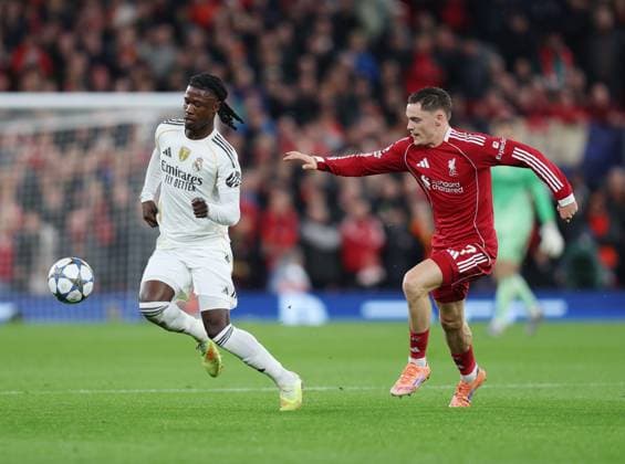 Liverpool, England, 4th November 2025. Eder Militao of Real Madrid and Florian Wirtz of Liverpool during the Liverpool vs Real Madrid UEFA Champions League match at Anfield, Liverpool. Picture credit should read: James Baylis Sportimage EDITORIAL USE ONLY. No use with unauthorised audio, video, data, fixture lists, club league logos or live services. Online in-match use limited to 120 images, no video emulation. No use in betting, games or single club league player publications. SPI_025_JB_LIVERPOOL_REAL_MADRID SPI-4264-0026