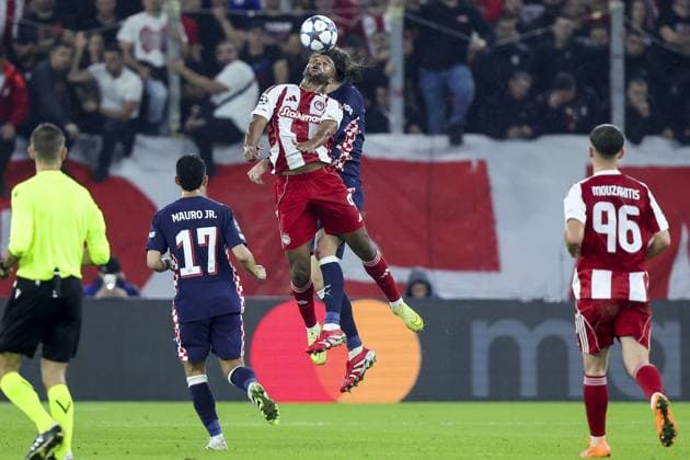 PIRAEUS , 04-11-2025 , Stadio Georgios Karaiskakis , season 2025 2026 , UEFA Champions League football League phase matchday 4 , match between Olympiacos and PSV , picture shows Olympiacos player Ayoub El Kaabi and PSV player Yarek Gasiorowski Olympiacos - PSV  x31860951x Copyright: