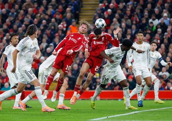Liverpool, England, 4th November 2025. Alexis Mac Allister of Liverpool scores their first goal during the Liverpool vs Real Madrid UEFA Champions League match at Anfield, Liverpool. Picture credit should read: James Baylis Sportimage EDITORIAL USE ONLY. No use with unauthorised audio, video, data, fixture lists, club league logos or live services. Online in-match use limited to 120 images, no video emulation. No use in betting, games or single club league player publications. SPI_044_JB_LIVERPOOL_REAL_MADRID SPI-4264-0043