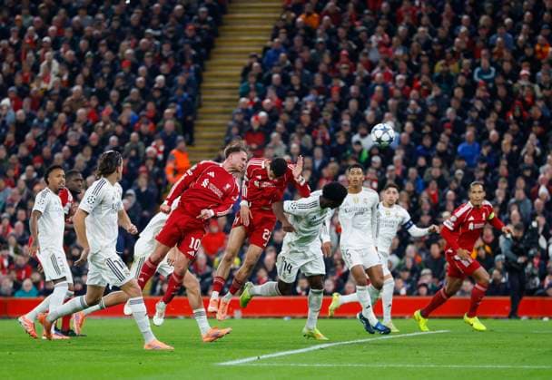 Liverpool, England, 4th November 2025. Alexis Mac Allister of Liverpool scoring their first goal during the Liverpool vs Real Madrid UEFA Champions League match at Anfield, Liverpool. Picture credit should read: James Baylis Sportimage EDITORIAL USE ONLY. No use with unauthorised audio, video, data, fixture lists, club league logos or live services. Online in-match use limited to 120 images, no video emulation. No use in betting, games or single club league player publications. SPI_056_JB_LIVERPOOL_REAL_MADRID SPI-4264-0055