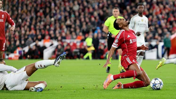 Liverpool v Real Madrid Champions League 04 11 2025. Liverpool midfielder Ryan Gravenberch (38) is brought down by the challenge from behind by Real Madrid midfielder Jude Bellingham (5) during the Champions League match between Liverpool and Real Madrid at Anfield, Liverpool, England on 4 November 2025. Liverpool Anfield Merseyside England Editorial use only , Copyright: xCraigxGallowayx PSI-23162-0117