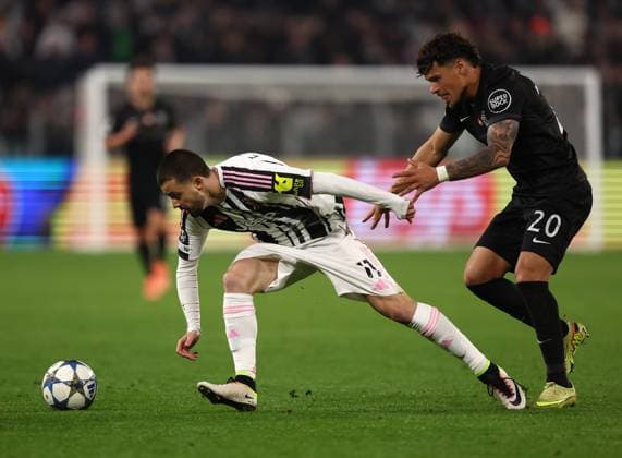 (251105) -- TURIN, Nov. 5, 2025 () -- Juventus Edon Zhegrova (L) vies with Sporting s Maximiliano Araujo during the UEFA Champions League football match between Juventus and Sporting in Turin, Italy, Nov. 4, 2025. () (SP)ITALY-TURIN-FOOTBALL-UEFA CHAMPIONS LEAGUE-JUVENTUS VS SPORTING CP Xinhua 