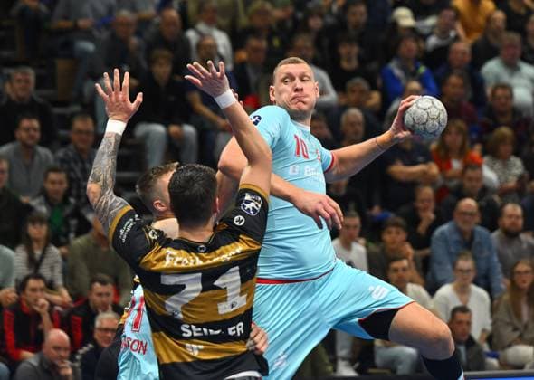 on the ball Dainis Kristopans Melsungen vs Oliver Seidler Dresden , HC Elbflorenz Dresden vs MT Melsungen, Handball, DHB Pokal, DHB, Cup, Season 2025 2026, Dresden, BallsportARENA Dresden, 05 11 2025,