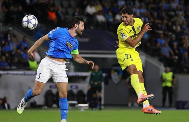 Cyprus Soccer Champions League Pafos David Goldar, left, and Villarreal s Santiago MouriAyos Perez jump for the ball during the Champions League opening phase soccer match between Pafos FC and Villarreal CF in Limassol, Cyprus, Wednesday, Nov. 4, 2025. Limassol Cyprus  Copyright: xDanilxShamkinx originalFilename:shamkin-notitle251105_npwyr.jpg
