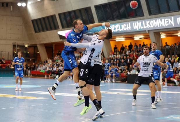 BAU 05 11 2025 Stuttgart Handball TVB Stuttgart vs SG Flensburg Handewitt, f l Kai Häfner TVB , Emil Jakobsen Flensburg