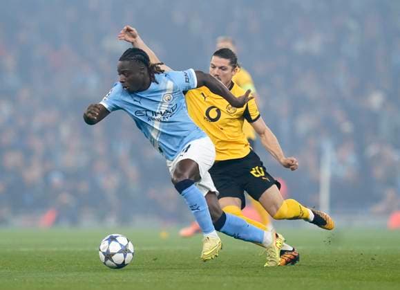 Manchester, England, 5th November 2025. Jeremy Doku of Manchester City in action with Marcel Sabitzer of Borussia Dortmund during the Manchester City vs Borussia Dortmund UEFA Champions League match at the Etihad Stadium, Manchester. Picture credit should read: Andrew Yates Sportimage EDITORIAL USE ONLY. No use with unauthorised audio, video, data, fixture lists, club league logos or live services. Online in-match use limited to 120 images, no video emulation. No use in betting, games or single club league player publications. SPI_016_AY_Man_City_Dortmund SPI-4268-0030