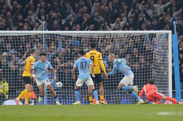 Manchester, England, 5th November 2025. Erling Haaland of Manchester City (r) celebrates scoring their second goal during the Manchester City vs Borussia Dortmund UEFA Champions League match at the Etihad Stadium, Manchester. Picture credit should read: Andrew Yates Sportimage EDITORIAL USE ONLY. No use with unauthorised audio, video, data, fixture lists, club league logos or live services. Online in-match use limited to 120 images, no video emulation. No use in betting, games or single club league player publications. SPI_025_AY_Man_City_Dortmund SPI-4268-0058