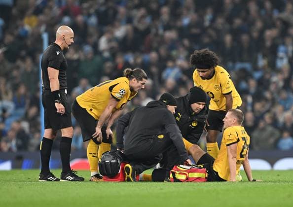 Manchester, England, 5th November 2025. Julian Ryerson of Borussia Dortmund receives treatment during the Manchester City vs Borussia Dortmund UEFA Champions League match at the Etihad Stadium, Manchester. Picture credit should read: Cody Froggatt Sportimage EDITORIAL USE ONLY. No use with unauthorised audio, video, data, fixture lists, club league logos or live services. Online in-match use limited to 120 images, no video emulation. No use in betting, games or single club league player publications. SPI_035_CF_Man_City_Dortmund SPI-4268-0060