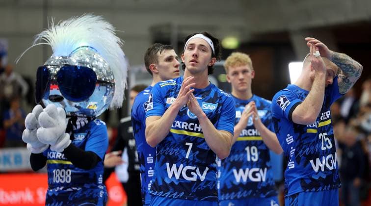 BAU 05 11 2025 Stuttgart Handball TVB Stuttgart vs SG Flensburg Handewitt, from left mascot Johnny Blue, Kasper Thorsen Lien, Patrick Zieker TVB disappointed