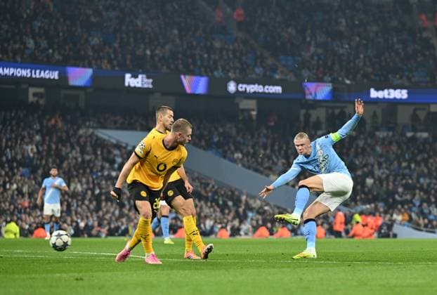Manchester, England, 5th November 2025. Erling Haaland of Manchester City (r) shoots during the Manchester City vs Borussia Dortmund UEFA Champions League match at the Etihad Stadium, Manchester. Picture credit should read: Cody Froggatt Sportimage EDITORIAL USE ONLY. No use with unauthorised audio, video, data, fixture lists, club league logos or live services. Online in-match use limited to 120 images, no video emulation. No use in betting, games or single club league player publications. SPI_037_CF_Man_City_Dortmund SPI-4268-0066