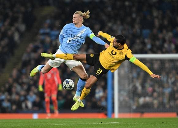 Manchester, England, 5th November 2025. Erling Haaland of Manchester City (l) tussles with Emre Can of Borussia Dortmund (r) during the Manchester City vs Borussia Dortmund UEFA Champions League match at the Etihad Stadium, Manchester. Picture credit should read: Cody Froggatt Sportimage EDITORIAL USE ONLY. No use with unauthorised audio, video, data, fixture lists, club league logos or live services. Online in-match use limited to 120 images, no video emulation. No use in betting, games or single club league player publications. SPI_058_CF_Man_City_Dortmund SPI-4268-0101