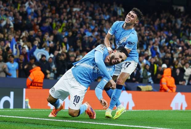Rayan Cherki of Manchester City celebrates scoring a goal to make it 4-1 with Phil Foden Manchester City v Borussia Dortmund, UEFA Champions League, Group Stage, Football, Etihad Stadium, Manchester, UK - 05 Nov 2025Manchester Etihad Stadium United Kingdom EDITORIAL USE ONLY No use with unauthorised audio, video, data, fixture lists, club league logos or live services. Online in-match use limited to 120 images, no video emulation. No use in betting, games or single club league player publications. Copyright: xMattxWest Shutterstockx 15642186an