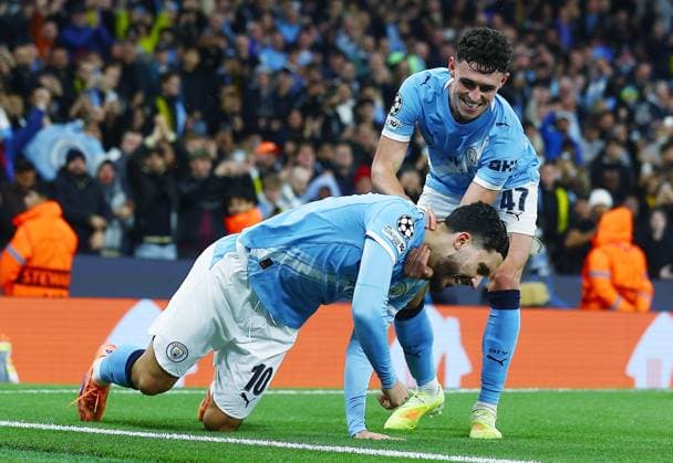 Rayan Cherki of Manchester City celebrates scoring a goal to make it 4-1 with Phil Foden Manchester City v Borussia Dortmund, UEFA Champions League, Group Stage, Football, Etihad Stadium, Manchester, UK - 05 Nov 2025Manchester Etihad Stadium United Kingdom EDITORIAL USE ONLY No use with unauthorised audio, video, data, fixture lists, club league logos or live services. Online in-match use limited to 120 images, no video emulation. No use in betting, games or single club league player publications. Copyright: xMattxWest Shutterstockx 15642186ao