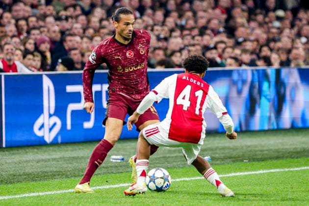 Leroy Sane of Galatasaray dribbles with the ball under pressure from Gerald Alders of AFC Ajax AFC Ajax v Galatasaray A.S., UEFA Champions League 2025 26 League Phase MD4, AFC Ajax v Galatasaray A.S., Johan Cruijff ArenA, November 5, 2025, Amsterdam, Netherlands.