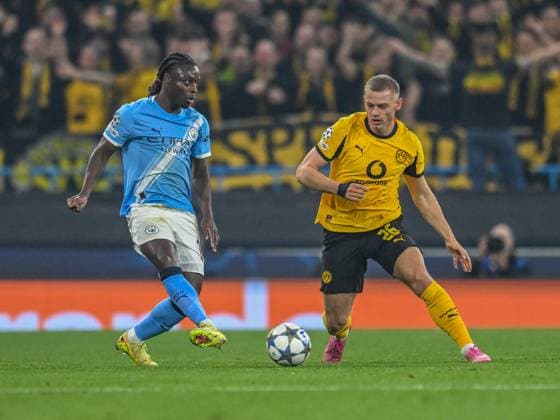 Manchester City v Borussia Dortmund UEFA Champions League Jeremy Doku of Manchester City Julian Ryerson of Borussia Dortmund during the UEFA Champions League match at the Etihad Stadium, Manchester UK Newspapers OUT Copyright: xKarlxVallantinex FIL-22465-0060