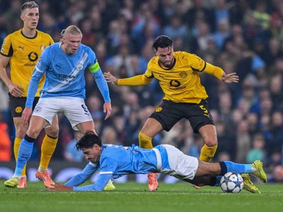 Manchester City v Borussia Dortmund UEFA Champions League Tijjani Reijnders of Manchester City is fouled by Ramy Bensebaini of Borussia Dortmund during the UEFA Champions League match at the Etihad Stadium, Manchester UK Newspapers OUT Copyright: xKarlxVallantinex FIL-22465-0070