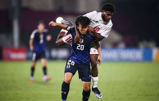 Football, Junior U 17 World Cup 2025 in Doha Qatar Preliminary Round 06 11 2025 Group B Japan New Caledonia Taiga Seguchi bottom, Japan v Ezekie Wamowe top, New Caledonia