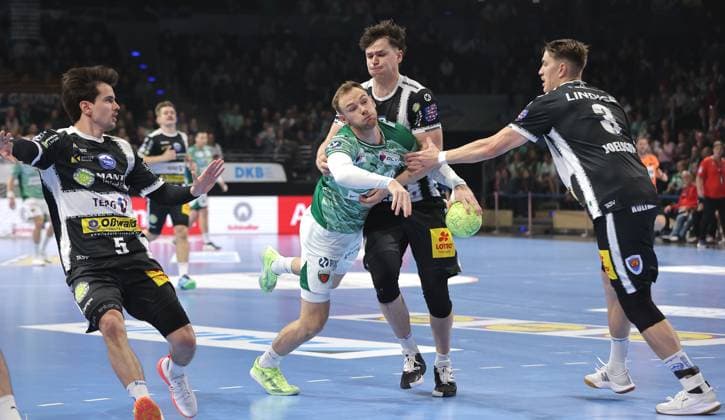 Timothy Reichmuth, Mathias Gidsel on the ball, Tillman Leu, Oskar Joelsson duel Game scene Action Sport Handball DHB Cup Round of 16 Men Season 2025 2026 06 11 2025 Füchse Berlin vs ThSV Eisenach