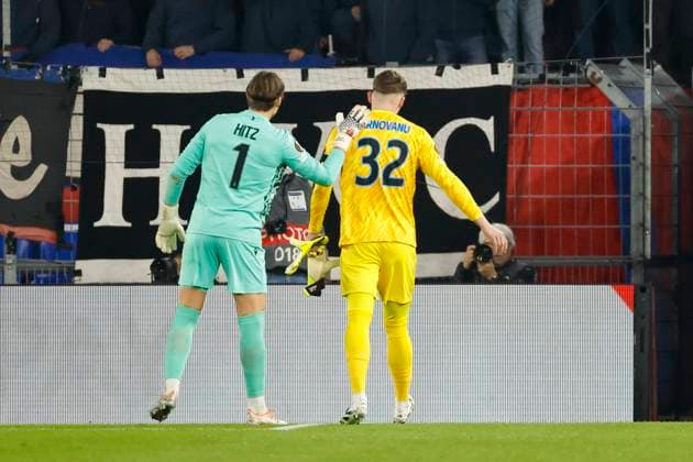 Stefan Tarnovanu FCSB Bucharest, 32 walks off the pitch after being shown a red card by referee Juxhin Xhaja ALB , left Marwin Hitz FC Basel, 01 , Switzerland, Football, UEFA Europa League, Matchday 4, 2025 2026, FC Basel vs FCSB Bucharest, 06 11 2025, Sankt Jakob Park, Basel, Switzerland Basel Sankt Jakob Park Canton Basel City Switzerland Copyright: xGrantxHubbsx