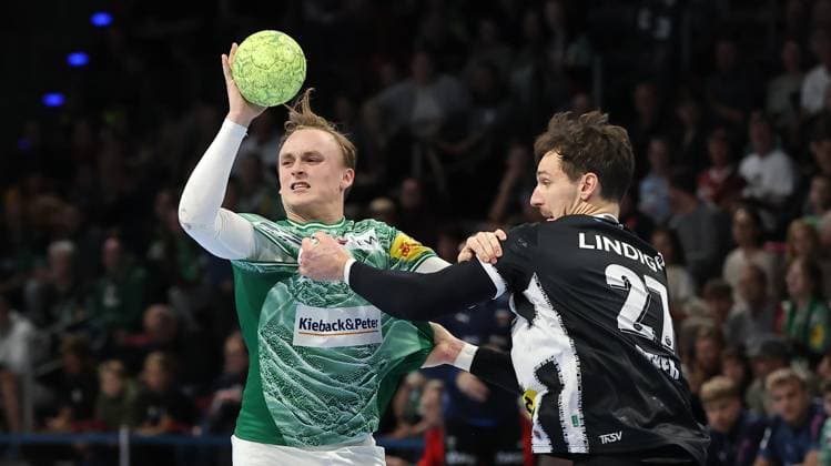 Tobias Schjoelberg Groendahl in a duel with Philipp Meyer Action Match scene Sport Handball DHB Cup Round of 16 Men Season 2025 2026 06 11 2025 Füchse Berlin vs ThSV Eisenach