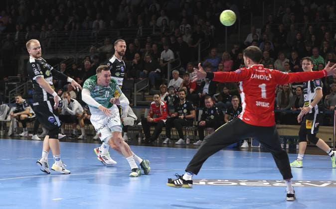 Lasse Andersson scores a goal against goalkeeper Matija Spikic duel Match scene Action Sport Handball DHB Pokal Round of 16 Men Season 2025 2026 06 11 2025 Füchse Berlin vs ThSV Eisenach