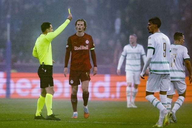 SALZBURG , 06-11-2025 , Red Bull Arena , season 2025 2026 , UEFA Europa League League phase . match between RB Salzburg and Go Ahead Eagles, Picture shows Referee Giorgi Kruashvili yellow card given to GA Eagles player Mathis Suray Salzburg - Go Ahead Eagles  x31890181x Copyright: