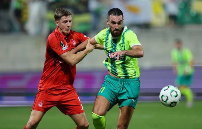 Mats Knoester of Aberdeen in action against Riad Bajio of AEK Larnaca AEK Larnaca v Aberdeen, UEFA Conference League, Group Stage, Football, AEK Arena, Larnaca, Cyprus - 06 Nov 2025Larnaca AEK Arena Cyprus EDITORIAL USE ONLY No use with unauthorised audio, video, data, fixture lists, club league logos or live services. Online in-match use limited to 120 images, no video emulation. No use in betting, games or single club league player publications. Copyright: xCharaxSavvides Shutterstockx 15642241bm