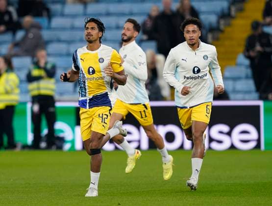 Birmingham, England, 6th November 2025. Captain Dor Peretz of Maccabi Tel-Aviv (l) leads the team out for warm up before the Aston Villa vs Maccabi Tel-Aviv FC UEFA Europa League match at Villa Park, Birmingham. Picture credit should read: Andrew Yates Sportimage EDITORIAL USE ONLY. No use with unauthorised audio, video, data, fixture lists, club league logos or live services. Online in-match use limited to 120 images, no video emulation. No use in betting, games or single club league player publications. SPI_028_AY_Villa_Macabbi SPI-4269-0028