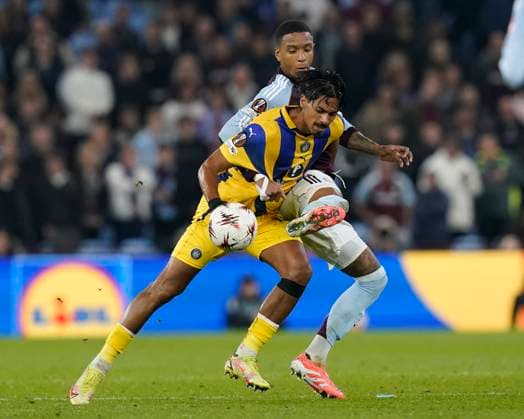 Birmingham, England, 6th November 2025. Ezri Konsa of Aston Villa tackles Dor Peretz of Maccabi Tel-Aviv during the Aston Villa vs Maccabi Tel-Aviv FC UEFA Europa League match at Villa Park, Birmingham. Picture credit should read: Andrew Yates Sportimage EDITORIAL USE ONLY. No use with unauthorised audio, video, data, fixture lists, club league logos or live services. Online in-match use limited to 120 images, no video emulation. No use in betting, games or single club league player publications. SPI_052_AY_Villa_Macabbi SPI-4269-0051