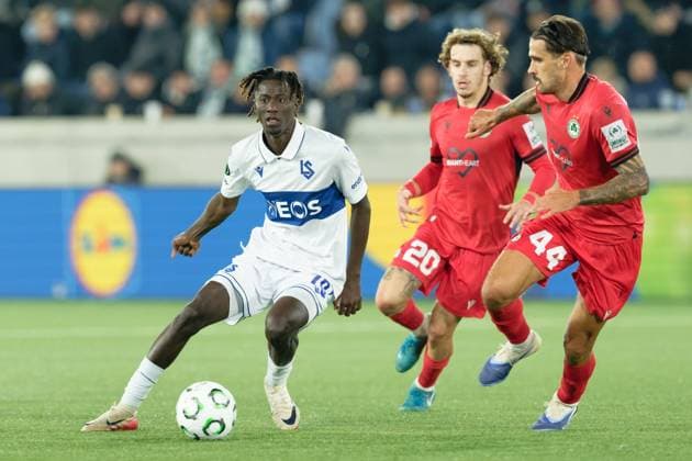 Gaoussou Diakite (70 Lausanne in action (close up) under pressure of Novica Erakovic (44 OmonoiaEvangelos) Andreou (20 Omonoia) during the UEFA Conference League match between Lausanne-Sport and Omonoia at Stade de la Tuiliere in Lausanne, Switzerland Copyright: xGiuseppexVelletrix xSPPx Sportspressphoto_SPR57893