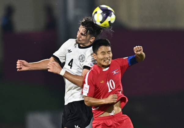 Germany v Korea DPR : Group G - FIFA U-17 World Cup Qatar 2025 Elias Vali Fard of Germany and Yu Jin Kim of Korea DPR in action during the FIFA U-17 World Cup Qatar 2025 Group G match between Germany and Korea DPR in Doha, Qatar, on November 7, 2025. DOHA Qatar Copyright: xNOUSHADx