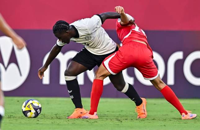 Germany v Korea DPR : Group G - FIFA U-17 World Cup Qatar 2025 Osman Turay of Germany and Jin Song So of Korea DPR in action during the FIFA U-17 World Cup Qatar 2025 Group G match between Germany and Korea DPR in Doha, Qatar, on November 7, 2025. DOHA Qatar Copyright: xNOUSHADxTHEKKAYILx