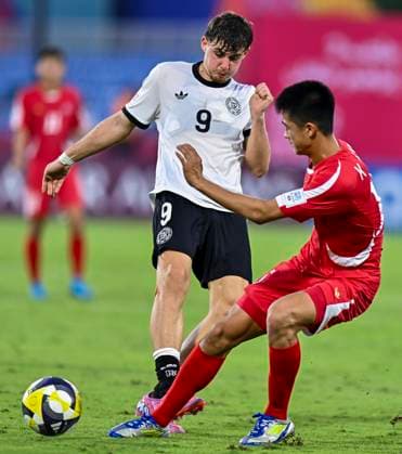 Germany v Korea DPR : Group G - FIFA U-17 World Cup Qatar 2025 Alexander Staff of Germany and Se Ung Kim of Korea DPR in action during the FIFA U-17 World Cup Qatar 2025 Group G match between Germany and Korea DPR in Doha, Qatar, on November 7, 2025. DOHA Qatar Copyright: xNOUSHADxTHEKKAYILx