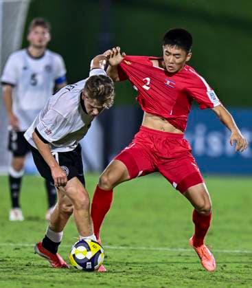 Germany v Korea DPR : Group G - FIFA U-17 World Cup Qatar 2025 Benjamin Ley (L) of Germany and SIl Bok Han of Korea DPR in action during the FIFA U-17 World Cup Qatar 2025 Group G match between Germany and Korea DPR in Doha, Qatar, on November 7, 2025. DOHA Qatar Copyright: xNOUSHADxTHEKKAYILx