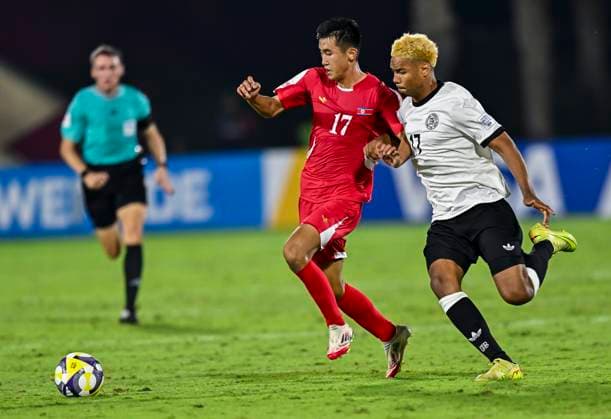 Germany v Korea DPR : Group G - FIFA U-17 World Cup Qatar 2025 Maik Afri Akumu of Germany and Kyong Bong Ri of Korea DPR in action during the FIFA U-17 World Cup Qatar 2025 Group G match between Germany and Korea DPR in Doha, Qatar, on November 7, 2025. DOHA Qatar Copyright: xNOUSHADxTHEKKAYILx